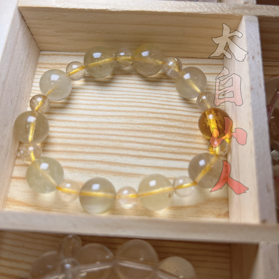 Natural Yellow Rabbit Hair Quartz Bracelet with Daoist Talisman Bead (12mm)